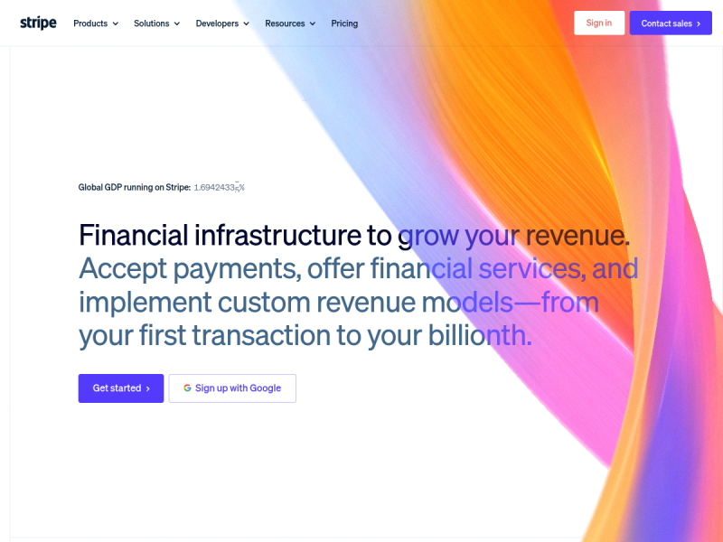 The Stripe homepage: a slim navigation bar, a large two-tone headline reading Financial infrastructure to grow your revenue, two buttons, and a bright orange, pink and blue ribbon gradient sweeping across the right side of a white page
